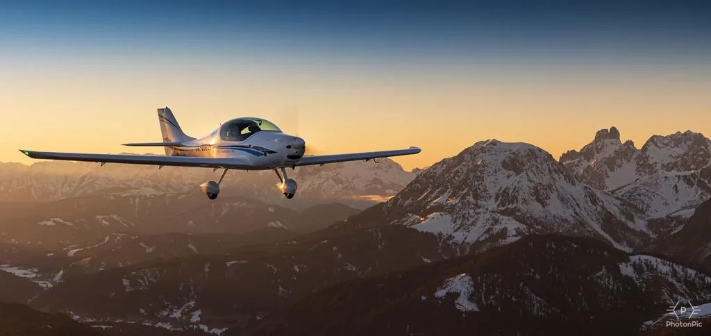 ATEC Faeta NG aircraft in flight over snowy mountains